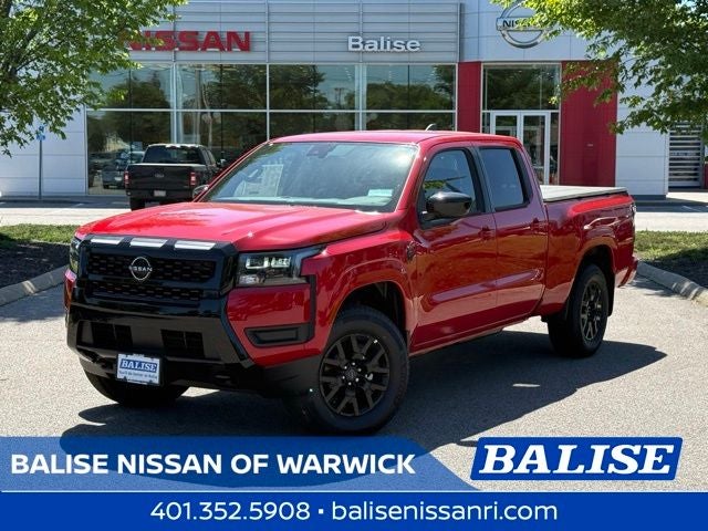 2026 Nissan Frontier SV in Red Alert — front three-quarter view