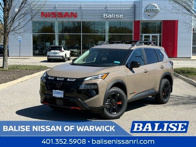 2026 Nissan Rogue Rock Creek in Baja Storm Metallic — front three-quarter view