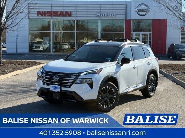 2026 Nissan Rogue Platinum in Everest White Pearl/Super Black — front three-quarter view
